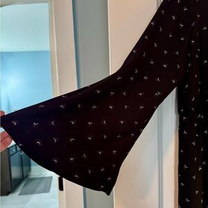 LOFT dress in Black, long sleeves that are flared mid arm.